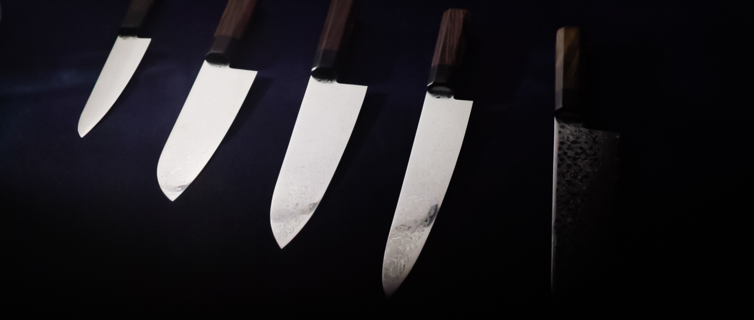 Image of this image showcases a set of japanese chef knives with sharp blades and wooden handles set against a dark background. ideal for culinary enthusiasts, these professional kitchen tools are perfect for precision cutting and premium cooking experiences. keywords: japanese chef knives, professional kitchen tools,