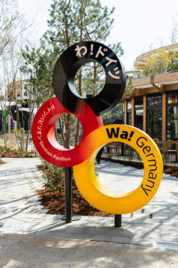 Image of colorful, ring-shaped sculpture featuring the words 